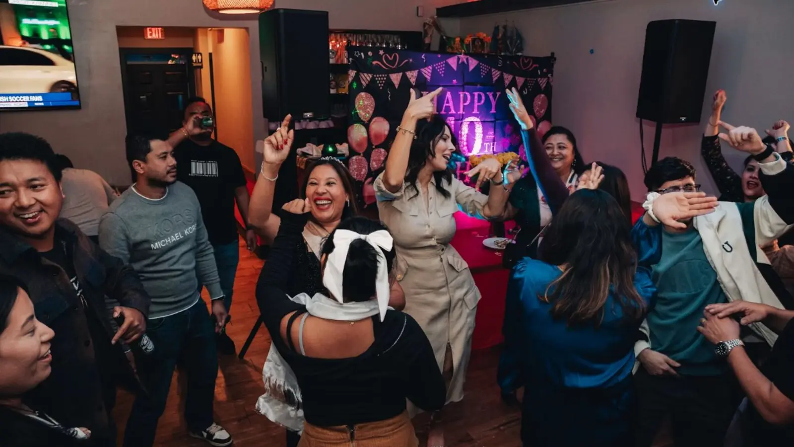 People socialising during a lively indoor nightlife celebration